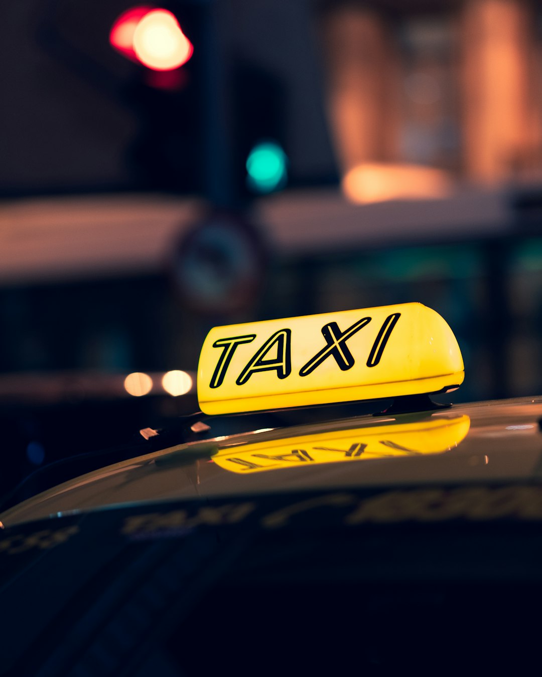 yellow-taxi-cab-on-road-during-night-time-7-r85l4eht8
